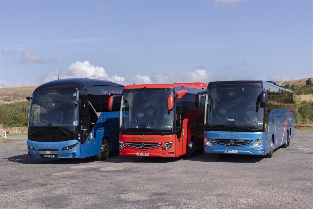 Three coaches parked side by side