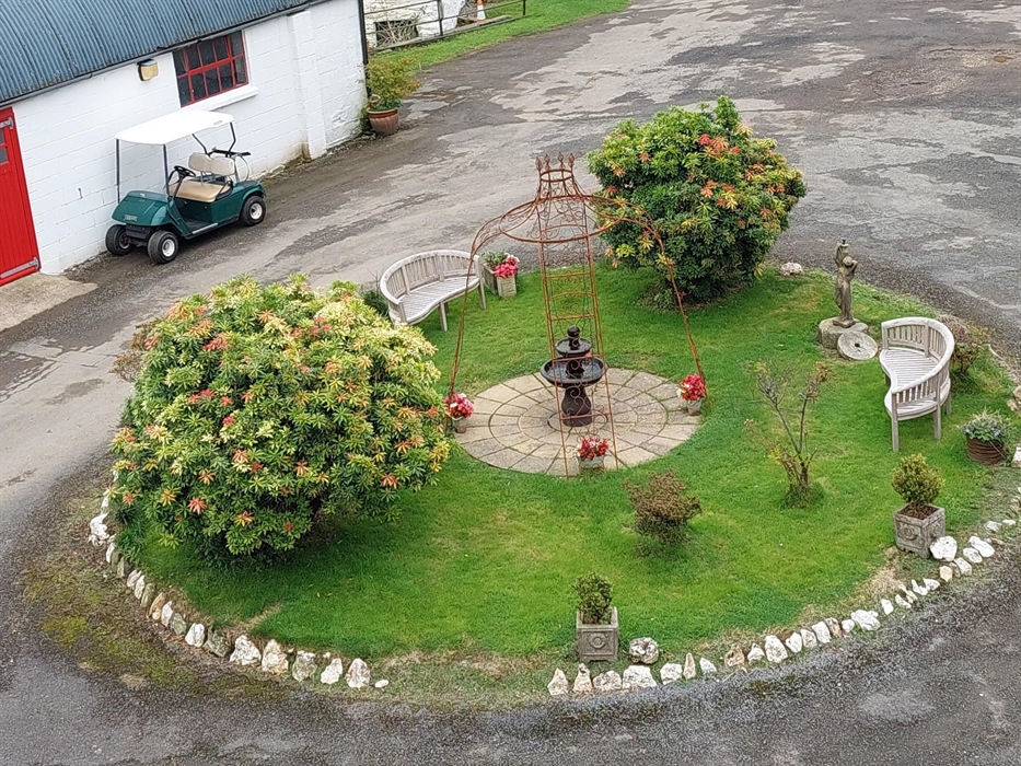 Wake to the sound of the birds song and trickle of water in the fountain in our original roundabout-view from one of 3 windows