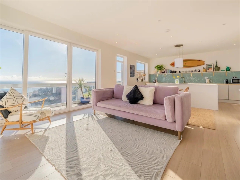 The open plan living area has direct access to the huge balcony which runs along the length of the apartment.