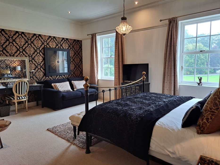 The luxurious Copper Beech Suite at Glangwili Mansion Luxury Bed & Breakfast featuring a superking size bed and a very comfortable memory foam sofabed