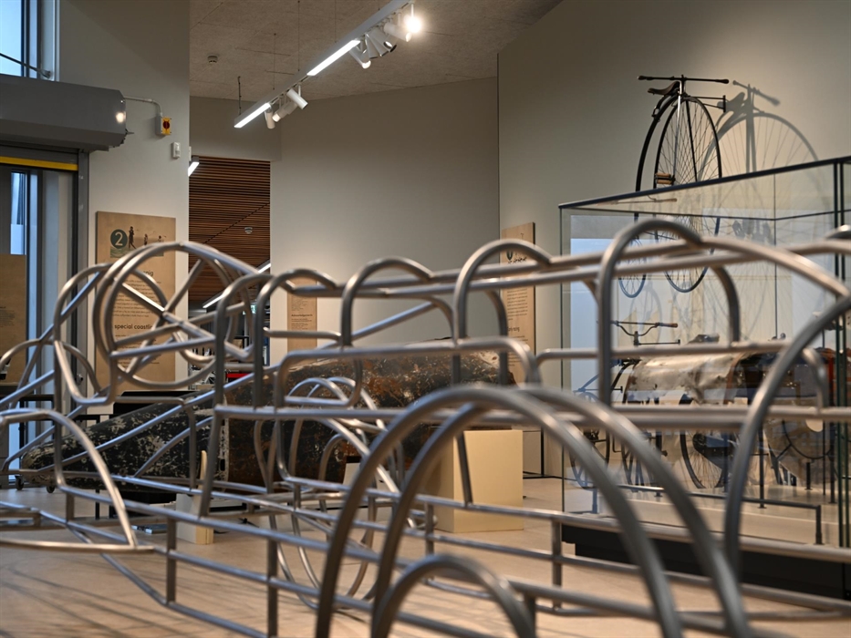 Steel frame model of Babs in the foreground with the tail of Sir Malcolm Campbell's BlueBird in the background in the Museum of Land Speed