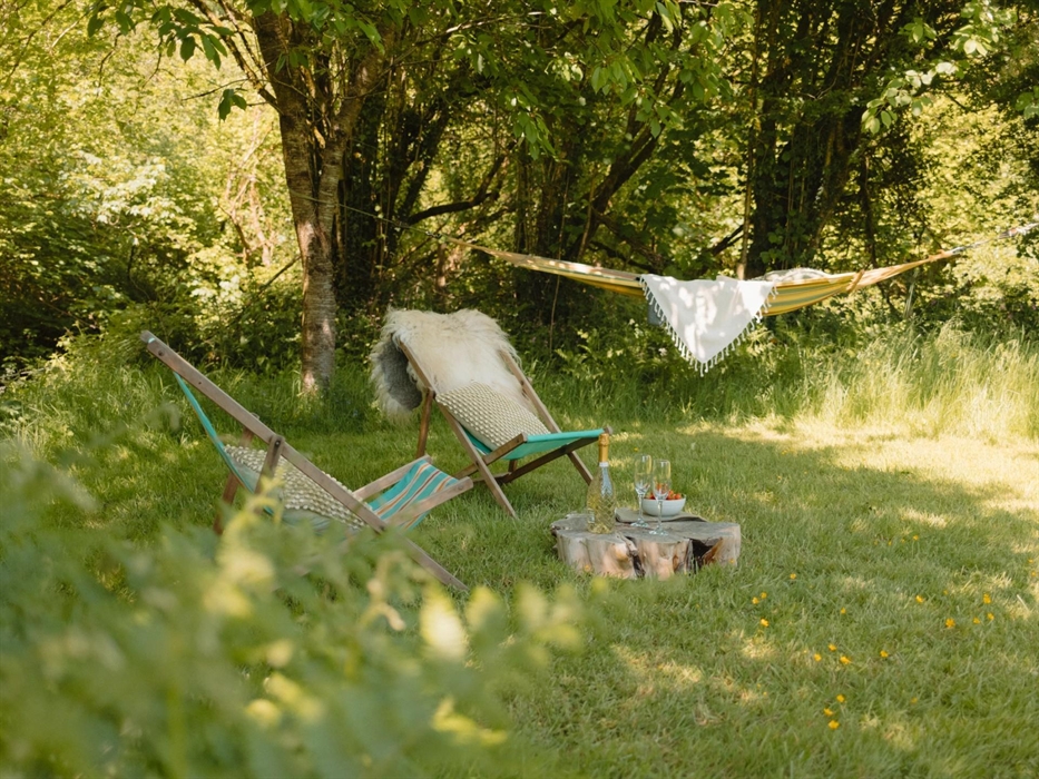 Relaxing by the river in the hammock and deckchairs - Luxury Glamping Cabin Carmarthenshire, West Wales