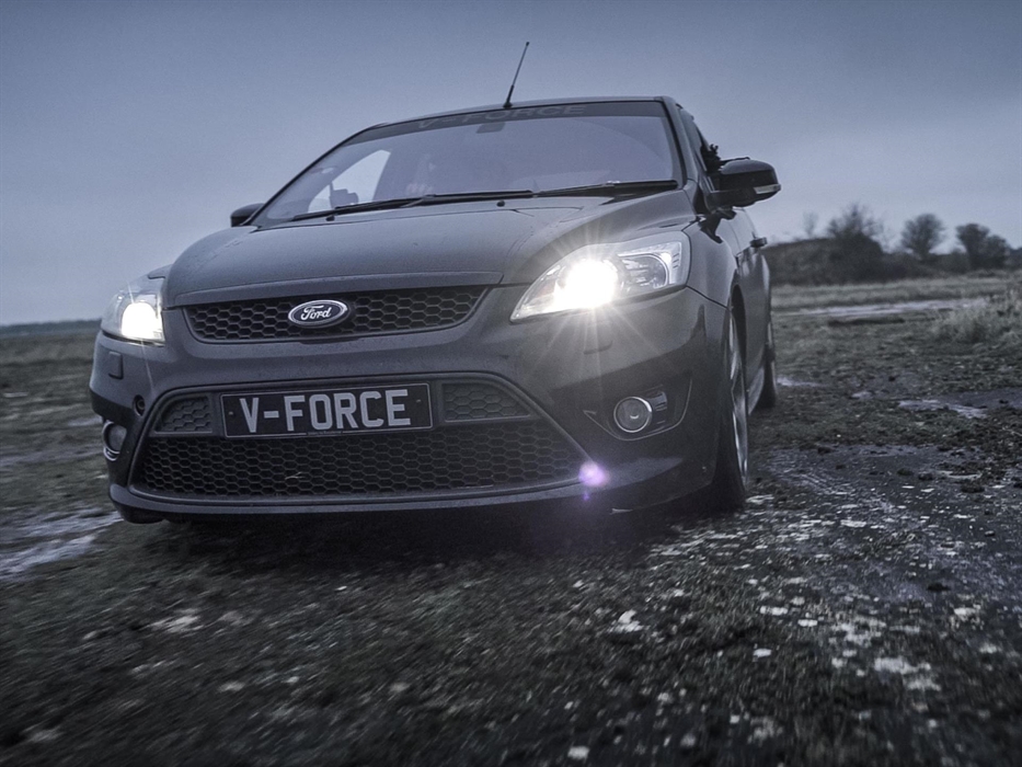 Evasive Driving in a black Ford Focus on gravel