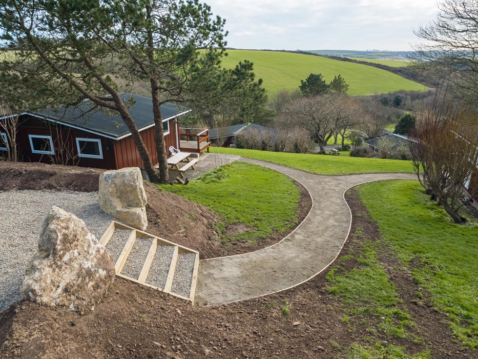 The harmony of nature and comfort illustrated by a lodge amidst greenery.
