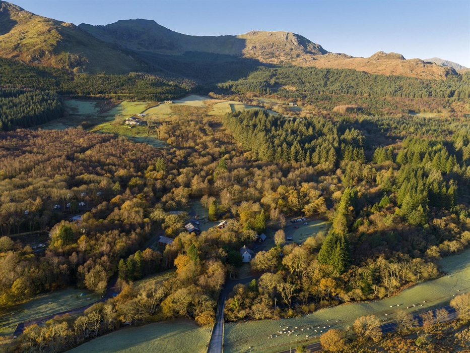 An aerial view of cabins nestled in the trees at Beddgelert.