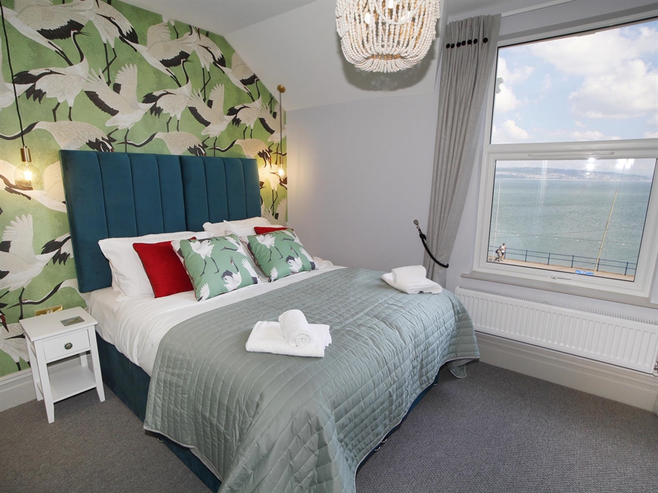 situated on the second floor with sea views. King size bed. TV and dressing table