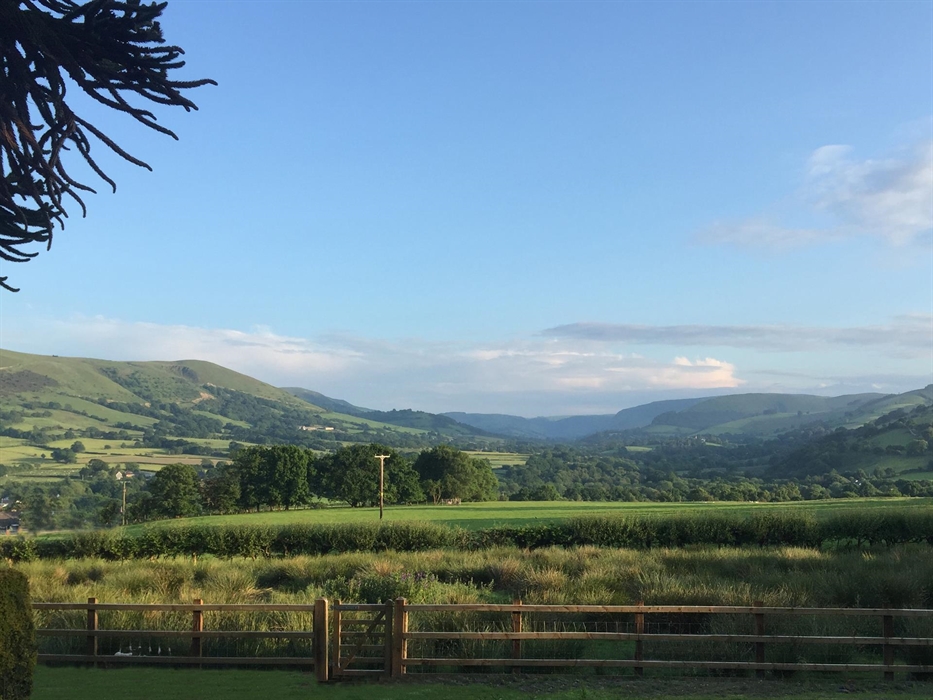 Set in 10 acres of rural pastureland, every room has impressive views of the surrounding Cambrian Mountains and rolling hills.