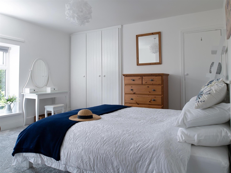 The main bedroom is very spacious.  It has a king-size bed and 2 large windows looking out on a lovely view.  There is plenty of room for the Z bed he