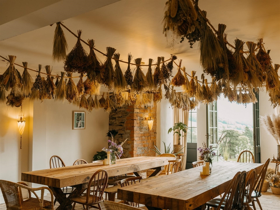 Set in the heart of the house and therefore at the heart of The Dreaming. With two enormous banqueting tables and dried flowers hanging from the rafte