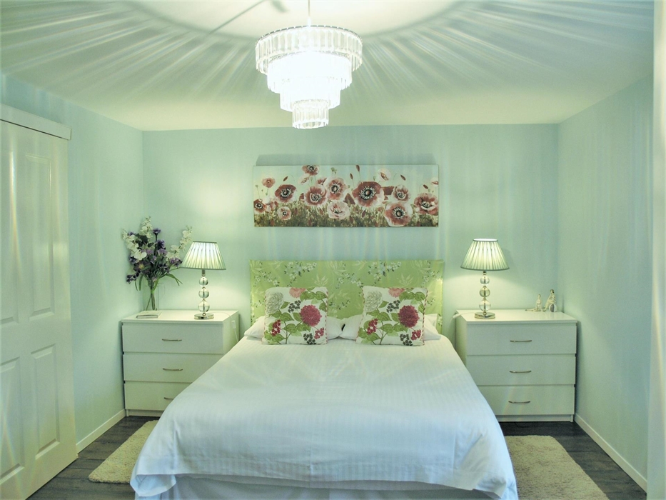 Romantic bedroom with a truly comfortable king bed and pristine bedding