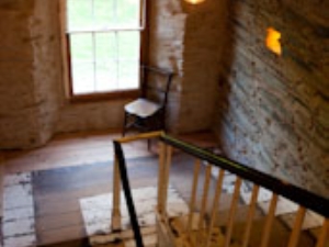 Original sweeping staircase that leads to bedrooms