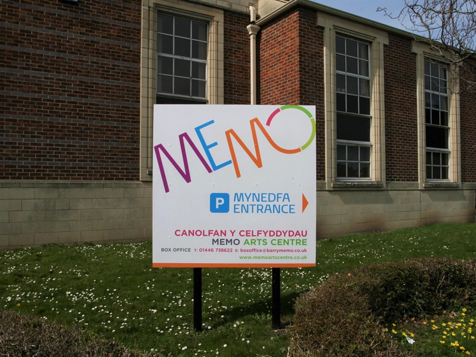 External Memo branded signage giving directions