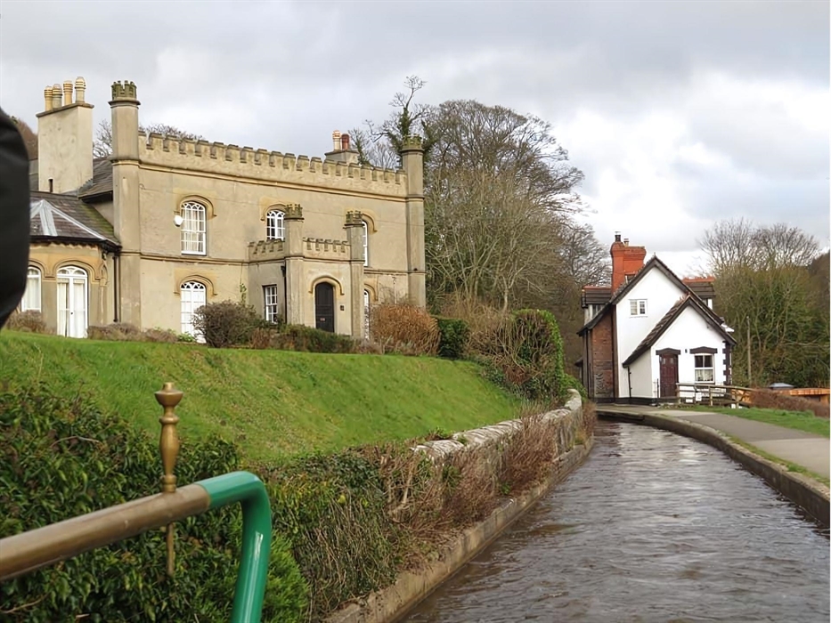 A scenic view of historic dwellings situated on the Llangollen canal.