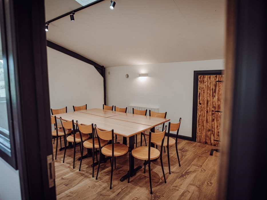 Smaller tables and chairs in a breakout room in the Grain Shed