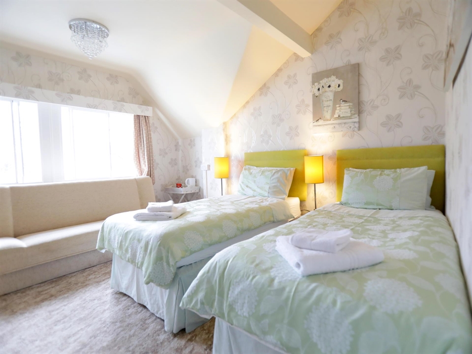 This Twin room offers flexibility as it easily transforms into a Superking. 
Enjoy its bright ambiance and relax in the comfortable seating area.