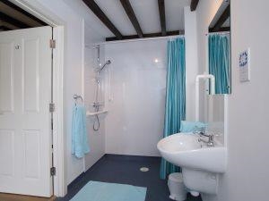 wet room fitted with aids to assist guests with restricted mobility