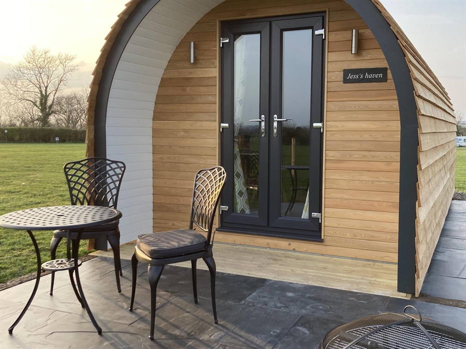 Outside Jess's pod with sun setting over the mountain