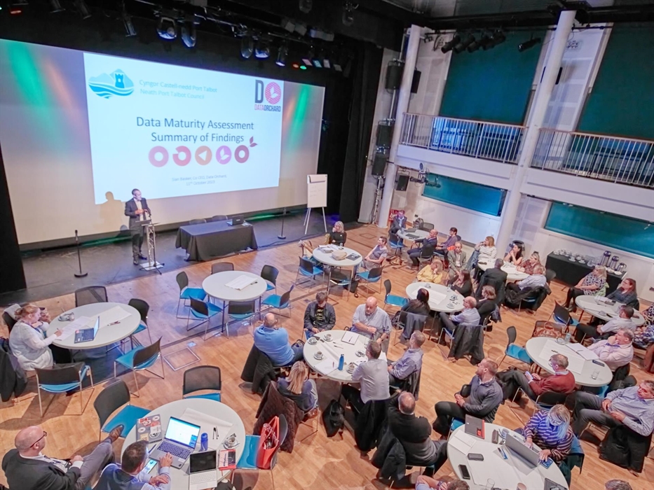 Main Auditorium set up as conference, cabaret style with large screen