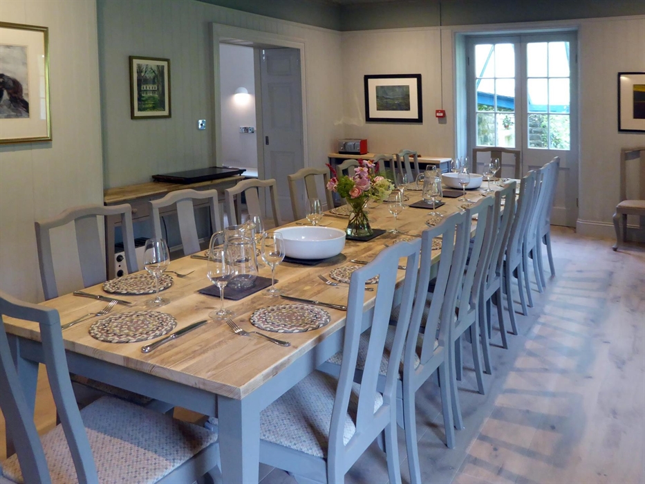 The lovely dining room seats up to 24 and leads out to the courtyard garden