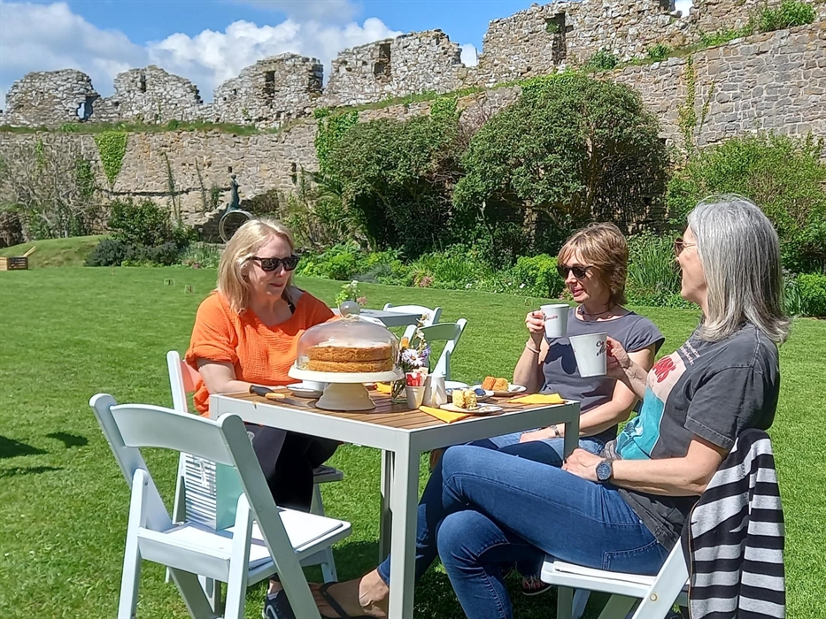 Visitors enjoying tea and homemade cake from the tearoom
