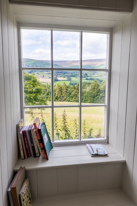 reading window nook with views of the beautiful parkland at The Library Cottage on Glanusk Estate
