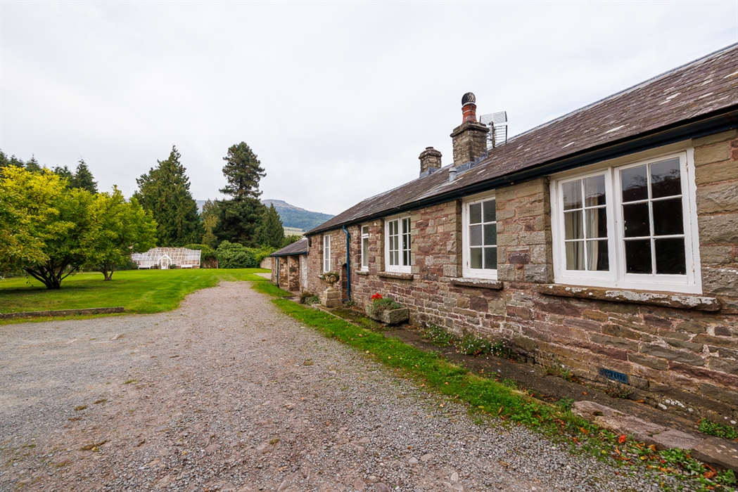 image of The Garden cottage at Glanusk Estate with the Glass house in the background