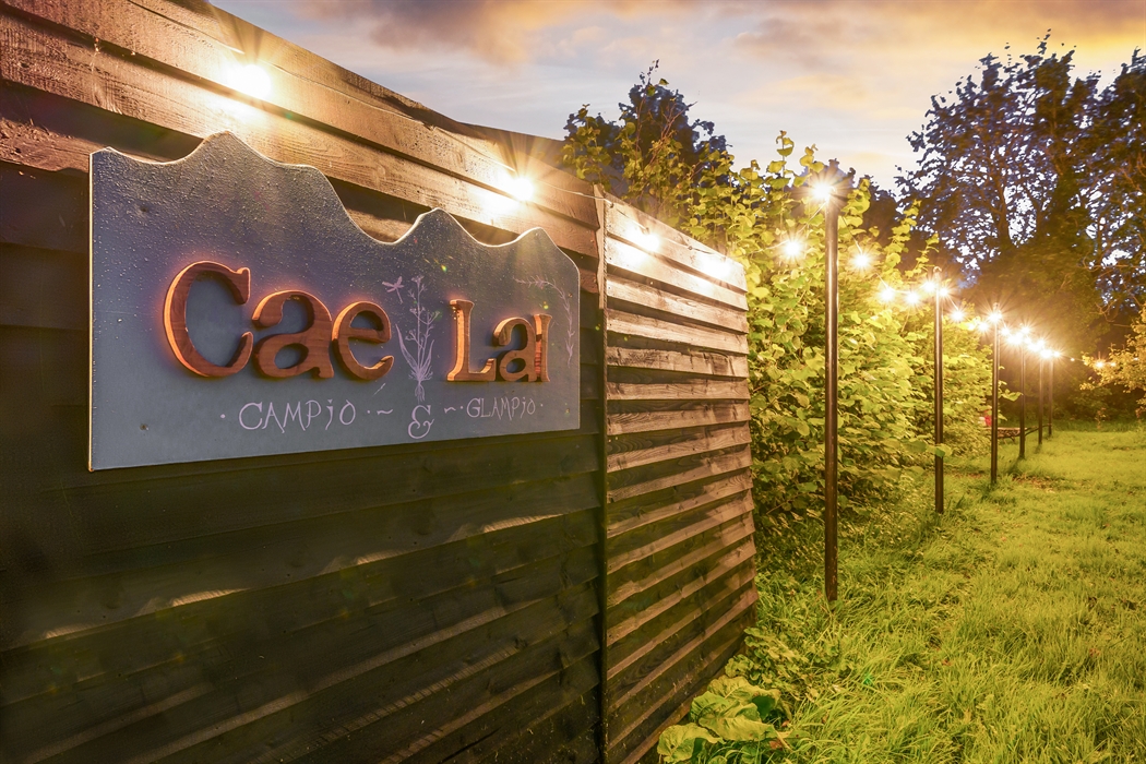 Cae Lal sign on the lawn with festoon lighting