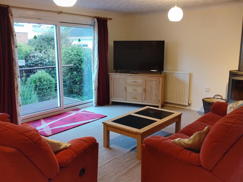 Large lounge diner with log burner and 55 inch tv