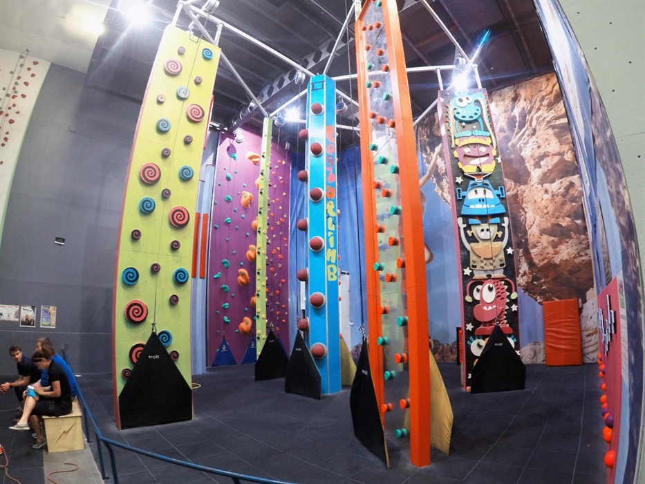 Colourful structures and shapes on slim climbing walls await children to climb them.