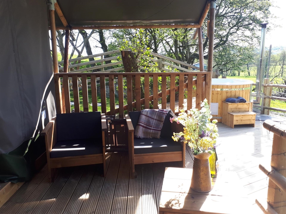 Sit and relax under the covered veranda of your Lodge.