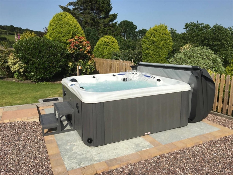 Relax and enjoy the surroundings in our new Hot Tub with 3 jets, waterfall LED lighting and Bluetooth audio!