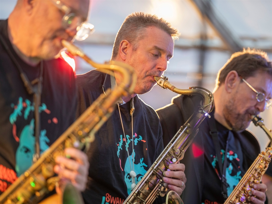 Close up of 3 men playing saxophones at the Swansea Jazz Festival