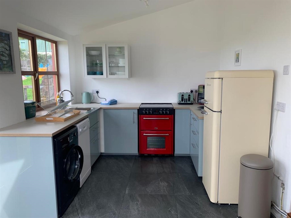 View of kitchen on ground floor at rear of Ceiliog Bach