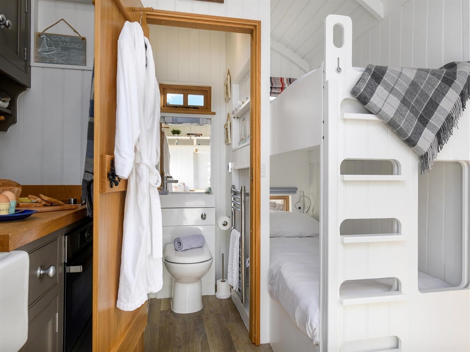 Here you can see how the bunks and bathroom work into the space at this end of the hut.  They are useful for storage or for when friends travel togeth