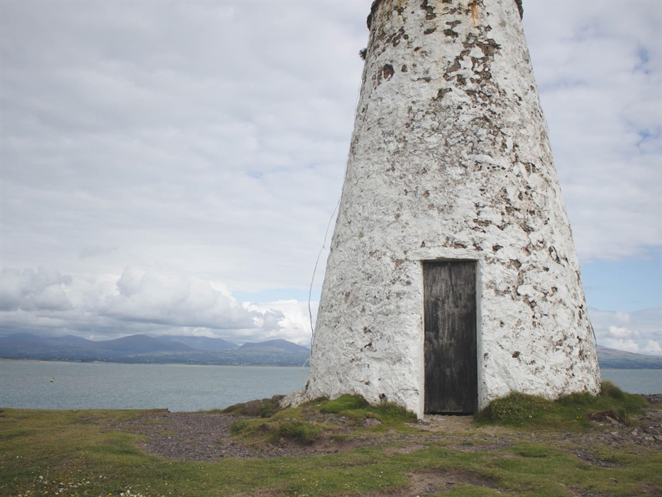 Rustic old lighthouse on the Isle of Anglesey in North Wales