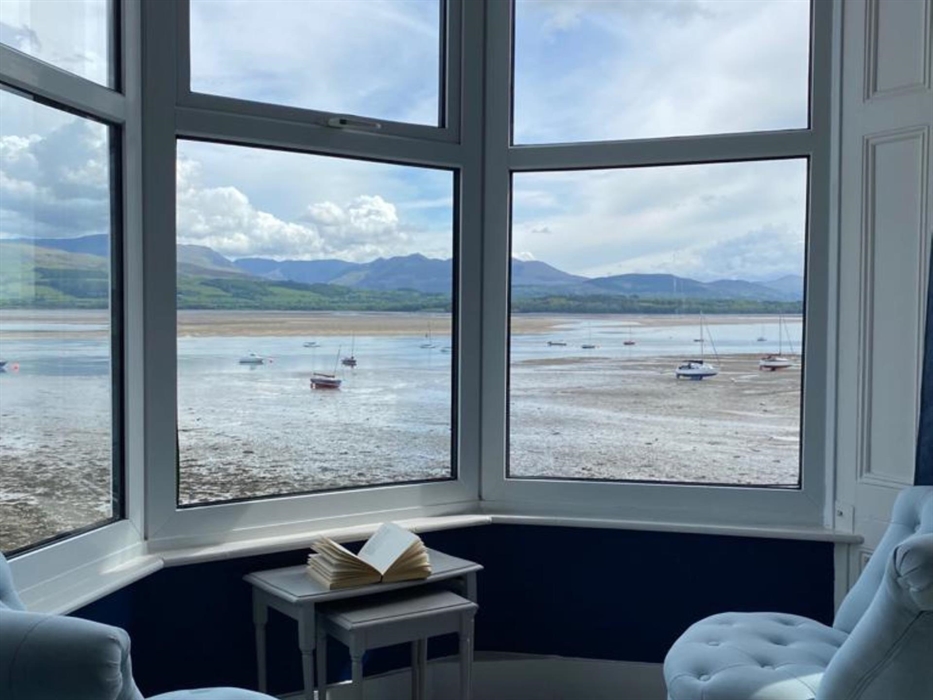 Across the Menai Straits to the Snowdonia Mountain Range - if you look closely you will be able to see the longest Zip Wire over near Bethesda