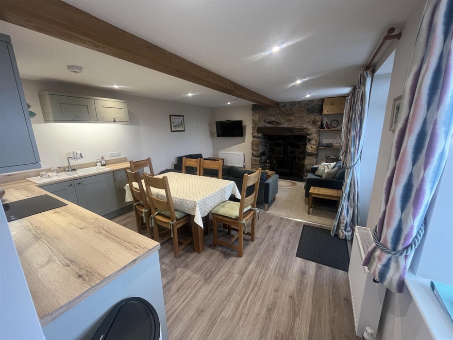 Kitchen diner with log burner in fire place