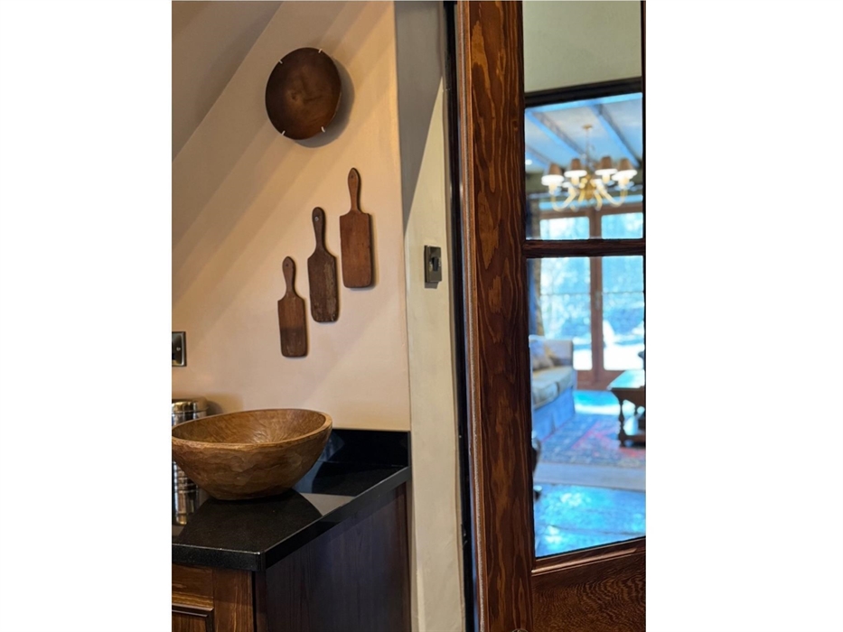 Kitchen leading into hallway