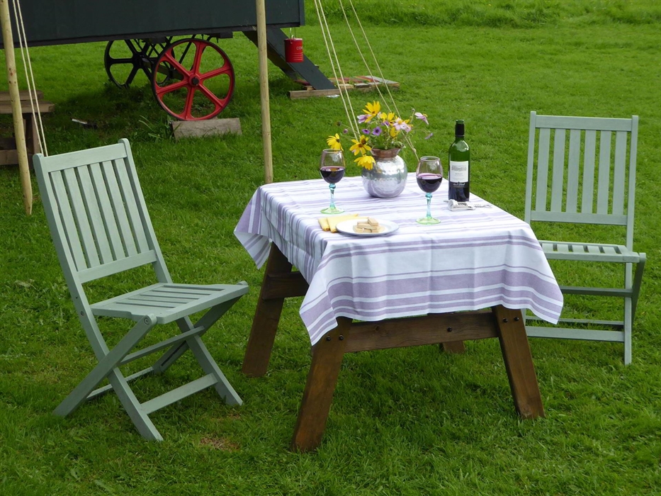 Table with wine and Chairs Set for dinning outside the Hygge Hut