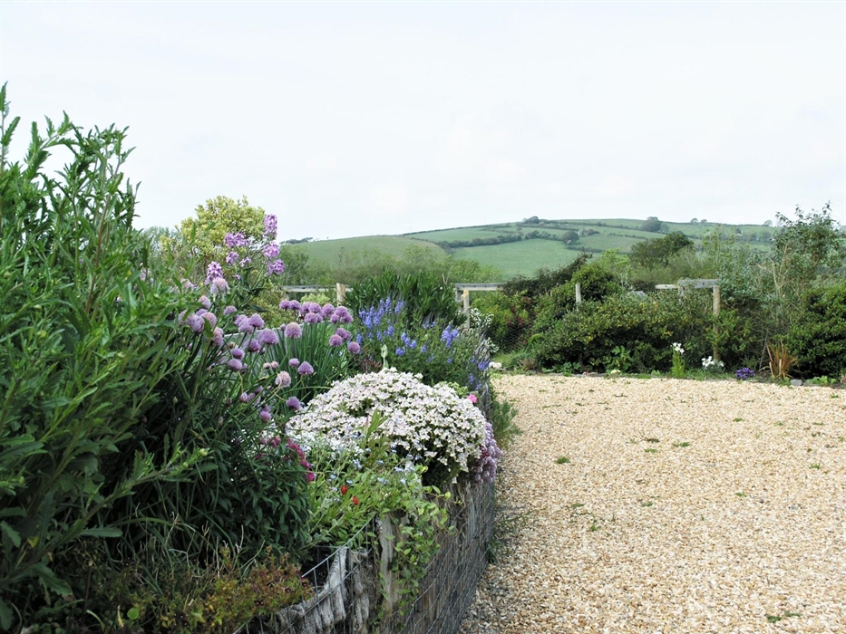 Glorious sunny aspect gardens with well planted raised beds to enjoy.