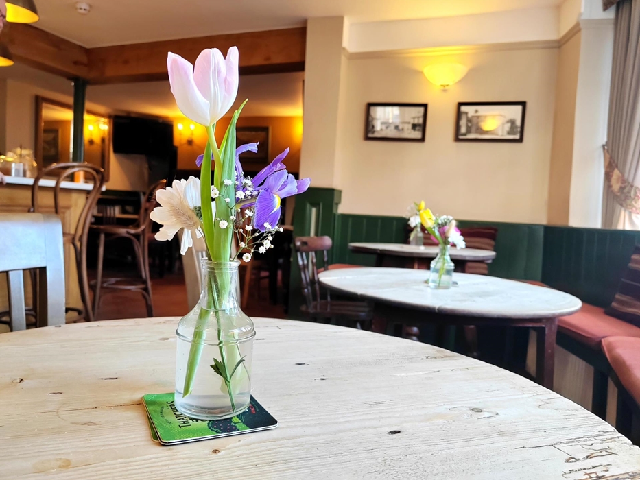 Fresh flowers in our cozy bar area