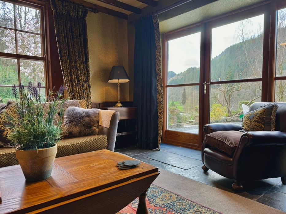 This is the lounge in Coedfa Bach (the workers quarters) which has two large windows with fabulous views of the Lledr Valley and the lawned gardens.