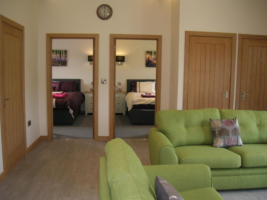 View into 2 of the bedrooms.