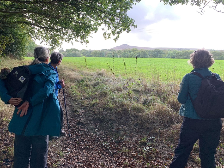 Pilgrims looking up at Carn Ingli (Rock of Angels) in Pembrokeshire