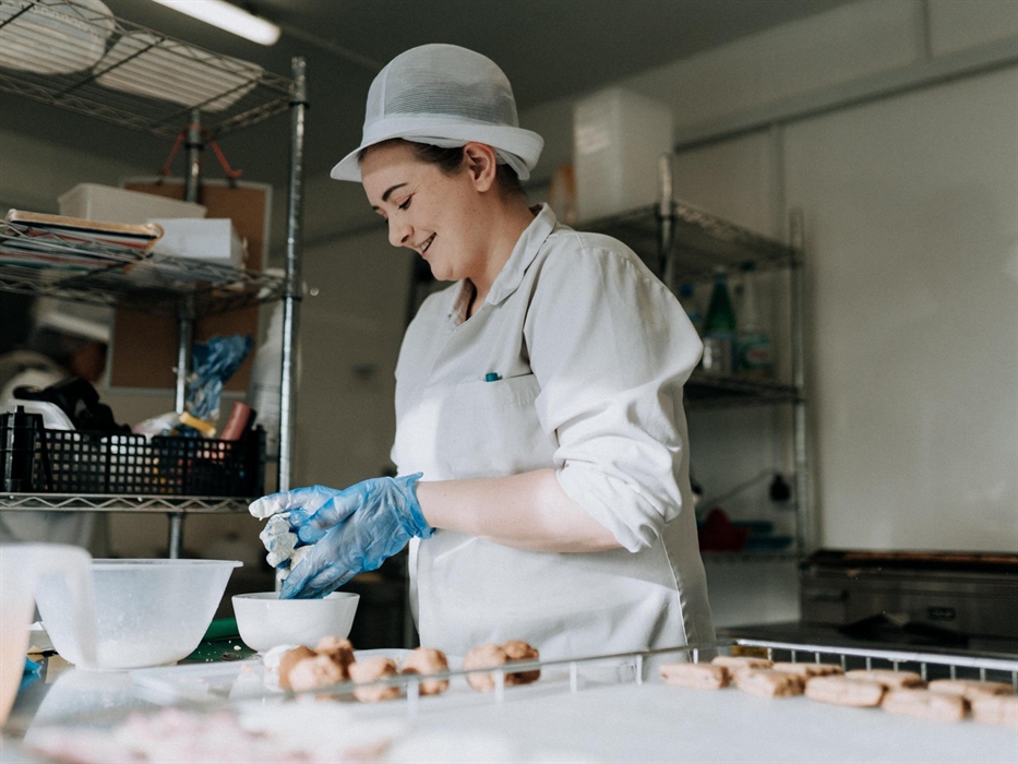 Baker at MamGu Welshcakes bakery, St Davids, Pembrokeshire