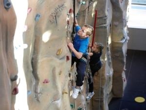 2 youngsters take on our climbing wall
