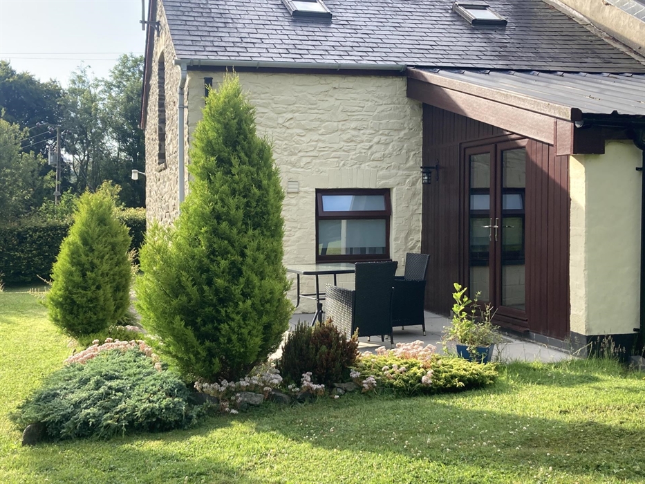 The French doors from the dining room lead onto a patio, ideal for coffee in the morning or wine in the afternoon.  This overlooks the valley and the
