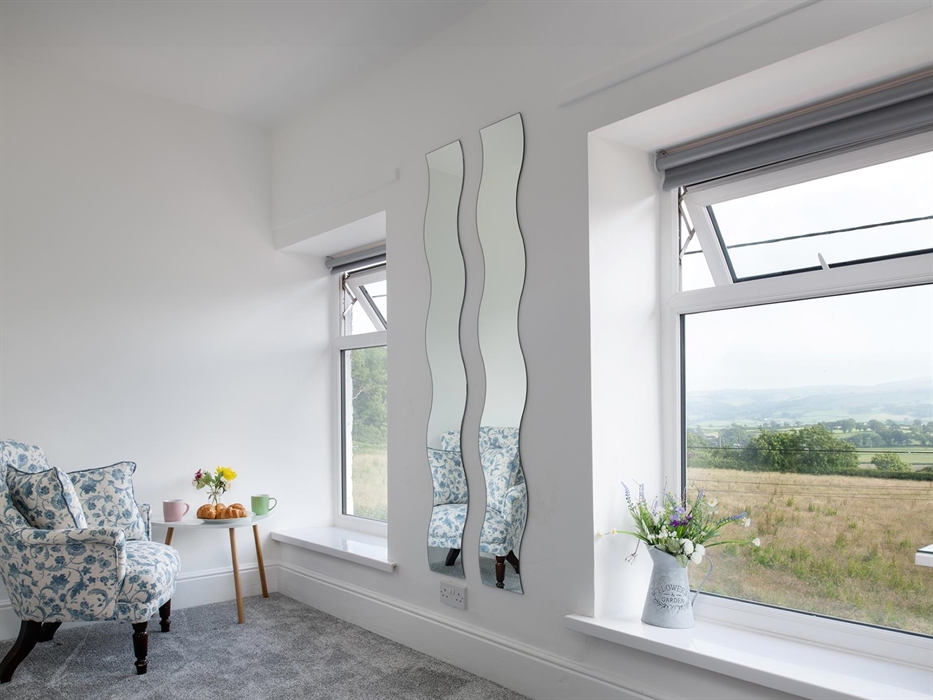 A cosy little space to sit and relax in the main bedroom