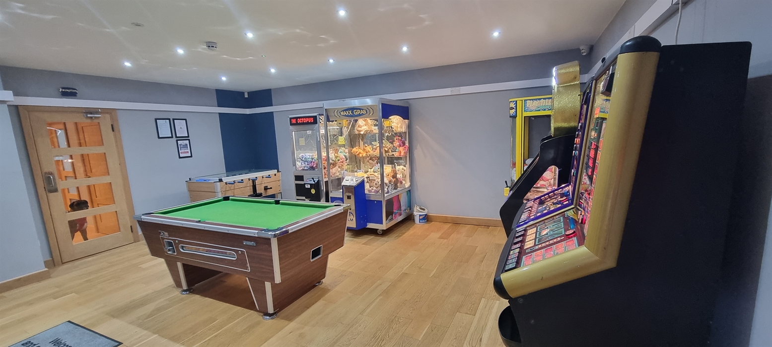 The Redford Cwtch Lounge – a cosy, welcoming space with soft seating, warm lighting, and rustic charm, perfect for relaxing with family or friends aft