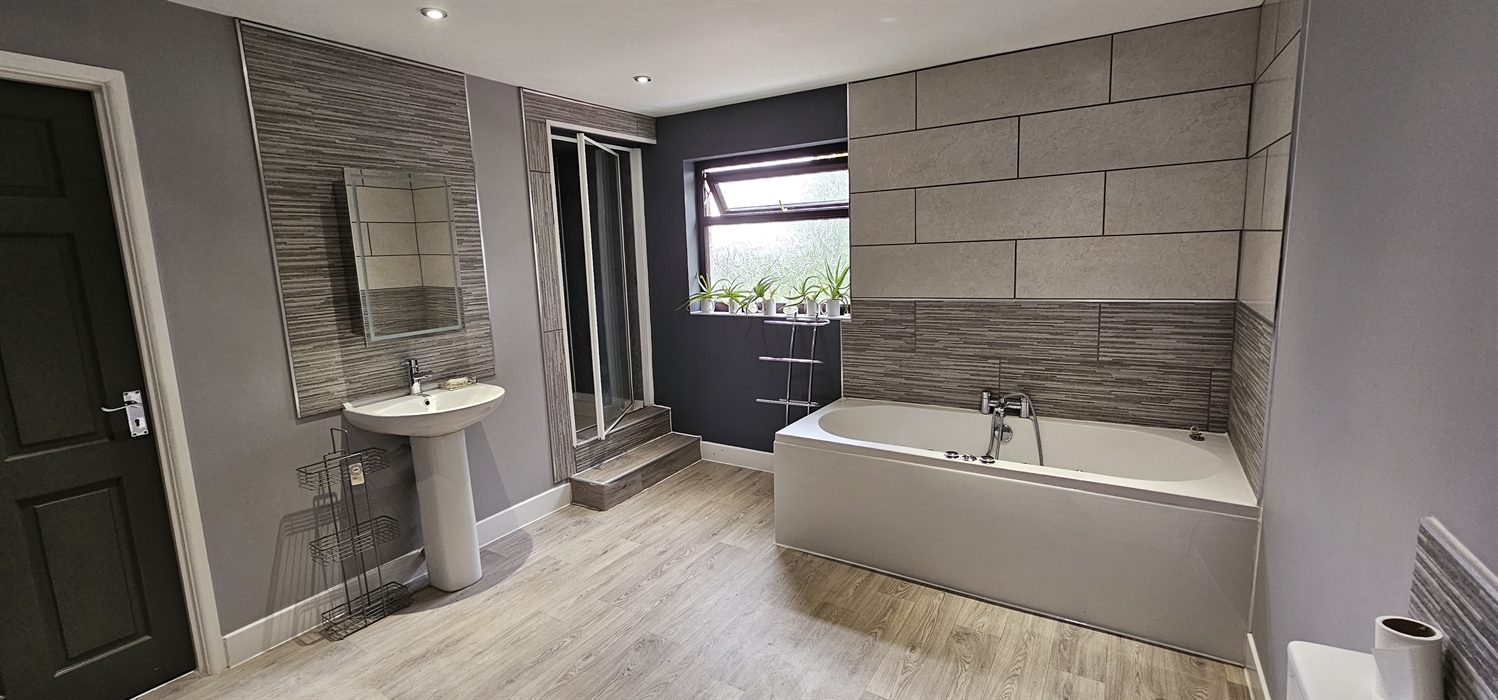 The Redford Cwtch Lounge – a cosy, welcoming space with soft seating, warm lighting, and rustic charm, perfect for relaxing with family or friends aft